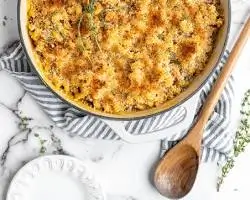 baked vegan mac and cheese in a casserole dish with golden breadcrumbS