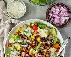 vegan cobb salad with avocado tomatoes tofu bacon chickpeas